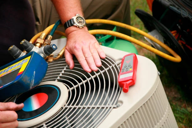 Diagnostic gauges and a meter used to check an outdoor condenser